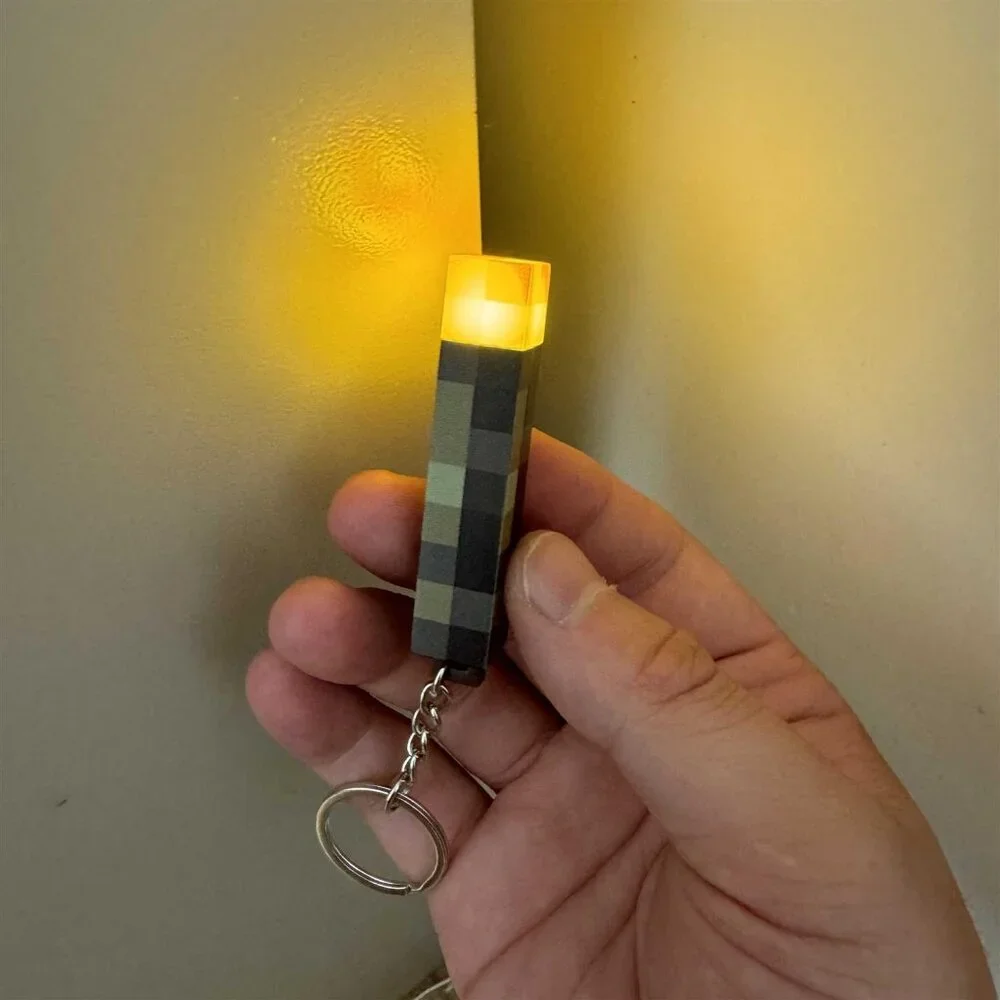 Pixel Torch Light Keychain – Battery Powered LED Mini Gadget for Fans!
